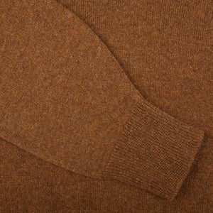 A close up of a William Lockie Kestrel Brown Deep V-Neck Lambswool Sweater.