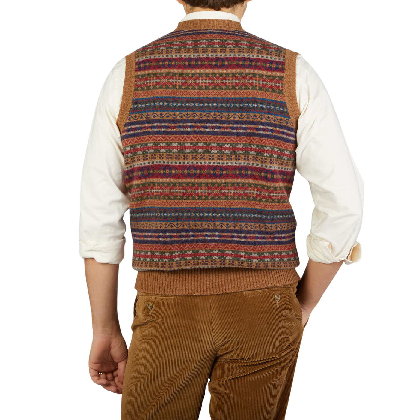 A man wearing a William Lockie Light Brown Fair Isle V-Neck Lambswool Slipover with a multi colored Scottish lambswool pattern.