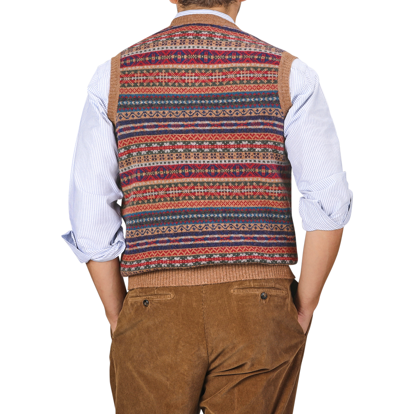 A person wearing a William Lockie Light Brown Fair Isle V-Neck Lambswool Slipover, a white shirt, and brown corduroy pants, viewed from the back.