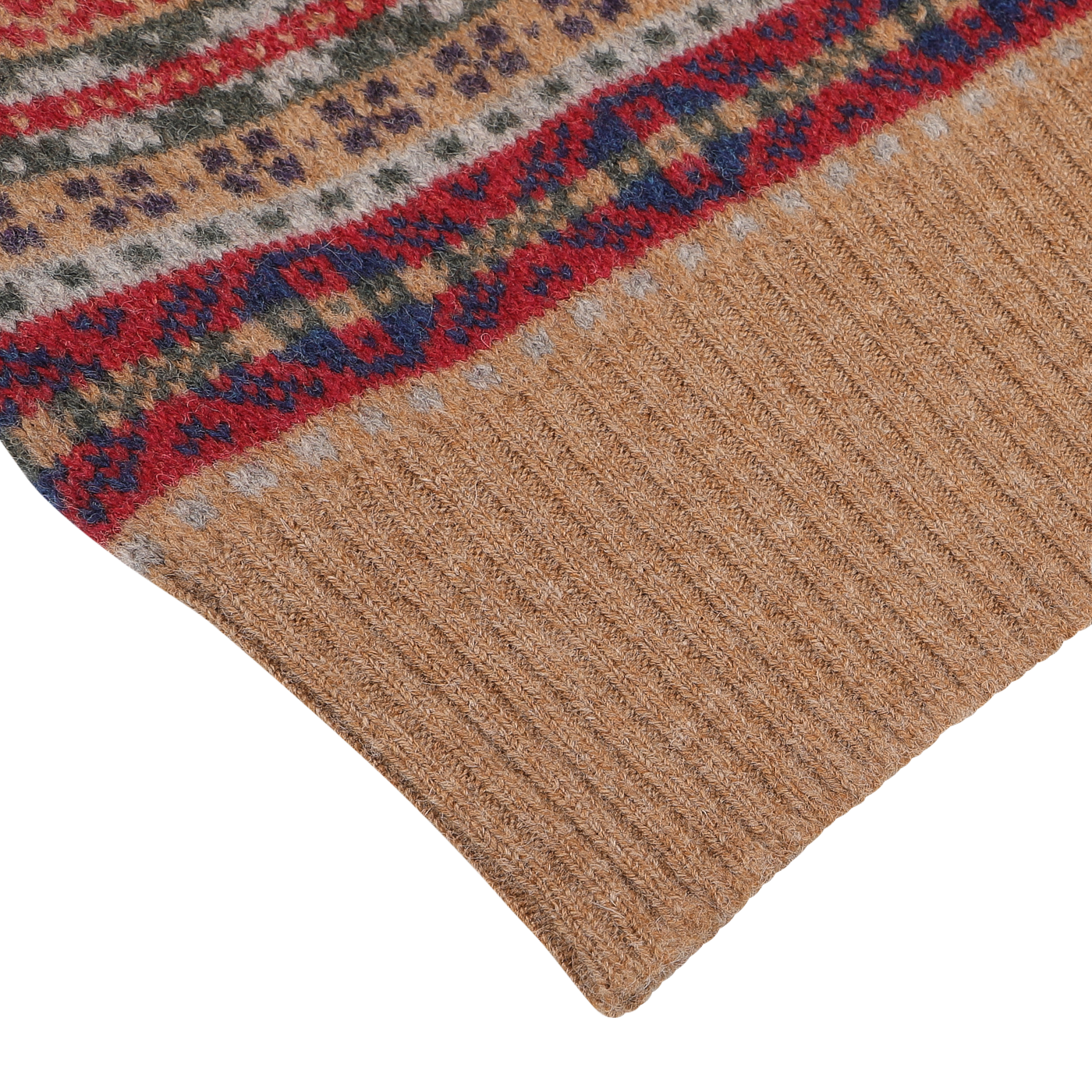 Close-up of the lower portion of a William Lockie Light Brown Fair Isle V-Neck Slipover, showcasing intricate patterns in red, blue, green, and beige, knitted from luxurious Scottish lambswool.