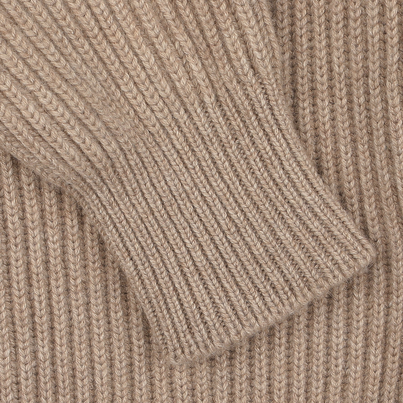 Close-up of the William Lockie Natural Beige Cashmere Shawl Collar Cardigan, highlighting its ribbed texture and sleeve detail, finished with elegant leather buttons.