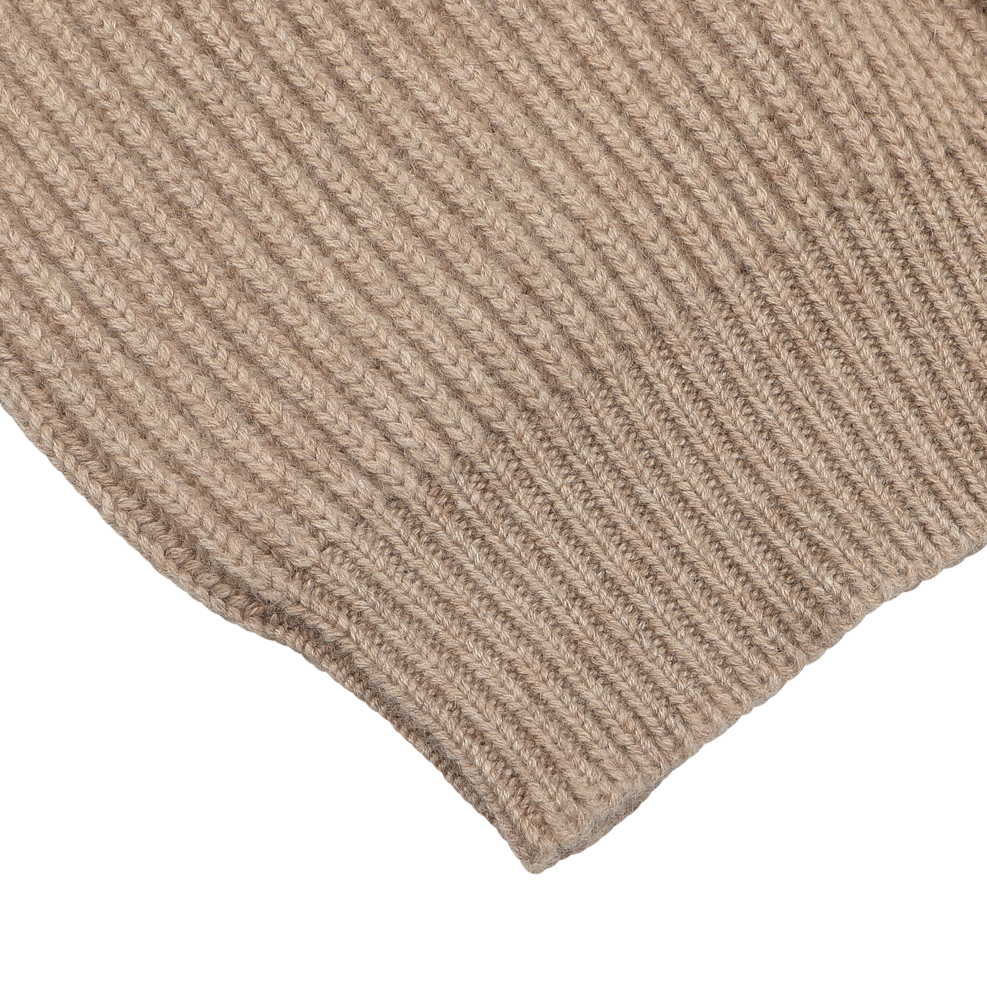 Close-up of the William Lockie Natural Beige Cashmere Shawl Collar Cardigan, highlighting its ribbed pattern, texture, and stitching details.