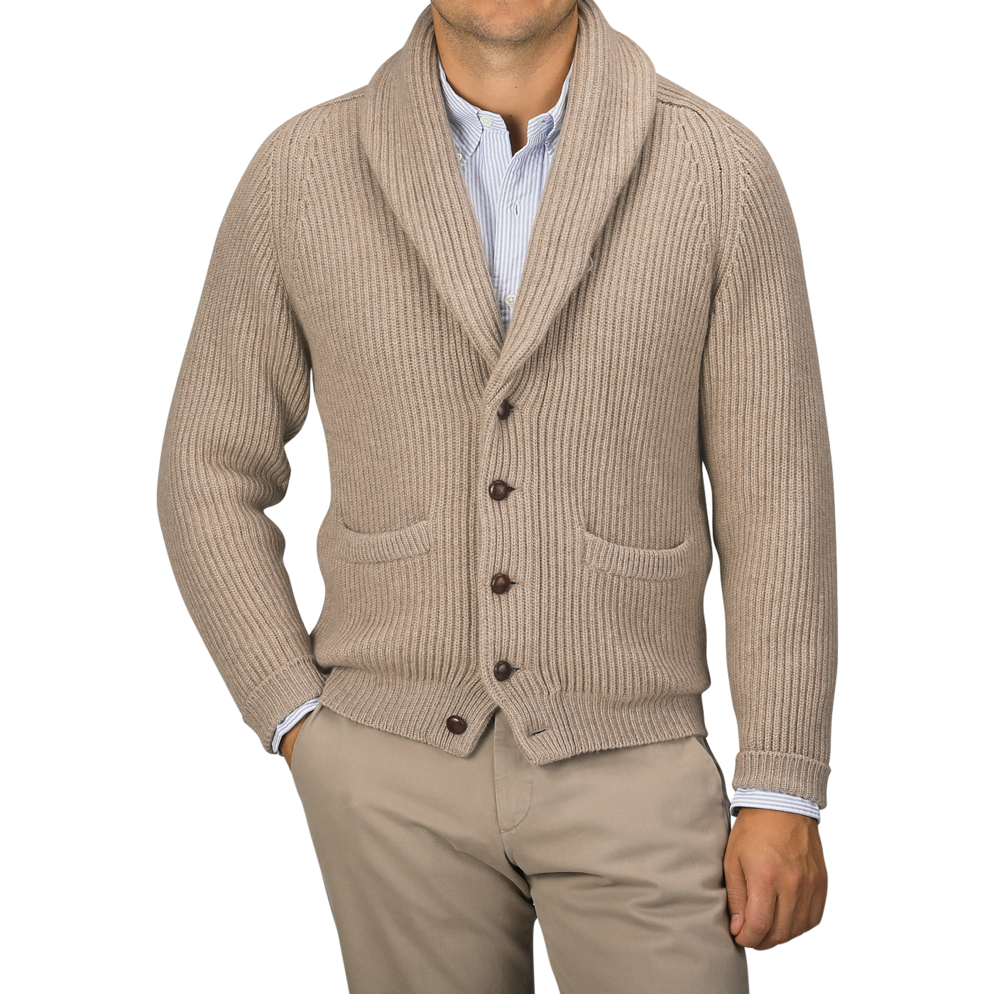 A person wearing a Natural Beige Cashmere Shawl Collar Cardigan by William Lockie with leather buttons over a light blue button-up shirt and khaki pants, hands in pockets.