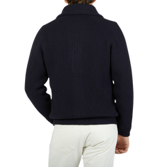 The back view of a man wearing a William Lockie Navy Blue Cashmere Shawl Collar Cardigan.