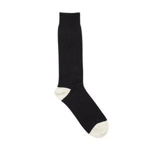 A single Navy Blue Cotton Contrast Cable-Knit Sock with white toes and heel, displayed against a white background, made by William Lockie.
