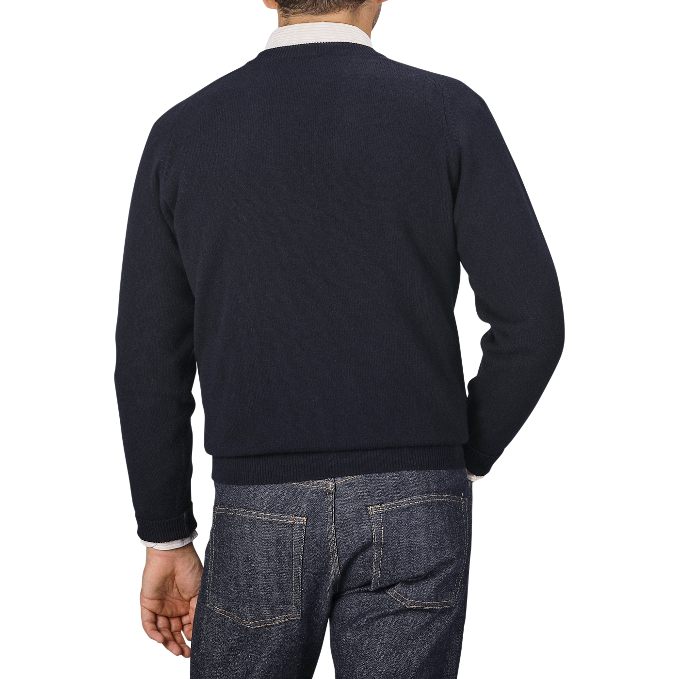 A man wearing a Navy Blue Deep V-Neck Lambswool Sweater by William Lockie and denim jeans is shown from the back against a plain gray background.