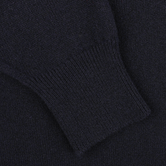 Close-up of a sleeve of the William Lockie Navy Blue Deep V-Neck Lambswool Sweater, showcasing the ribbed cuff detailing.