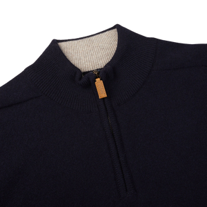 A Navy Blue Lambswool 1/4 Sweater with a gold zipper by William Lockie.