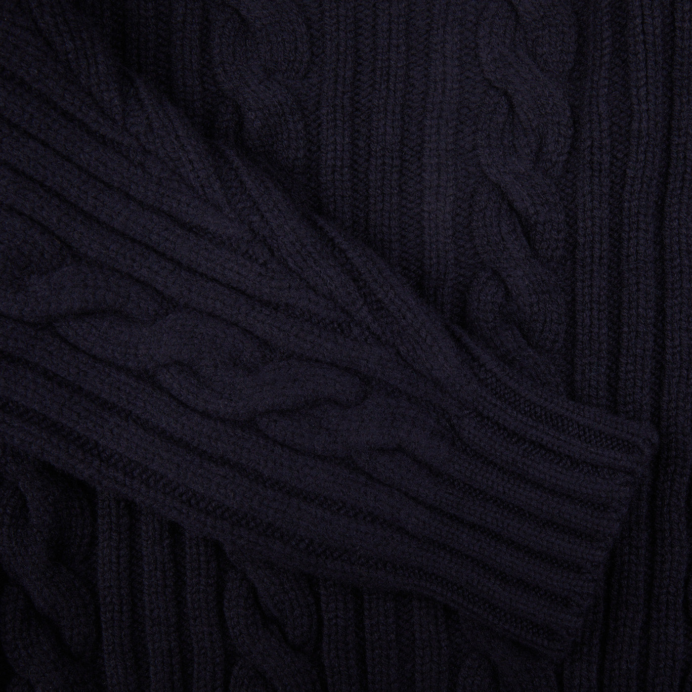 A close up of a Navy Cable-Knit Lambswool Shawl Collar Cardigan by William Lockie.