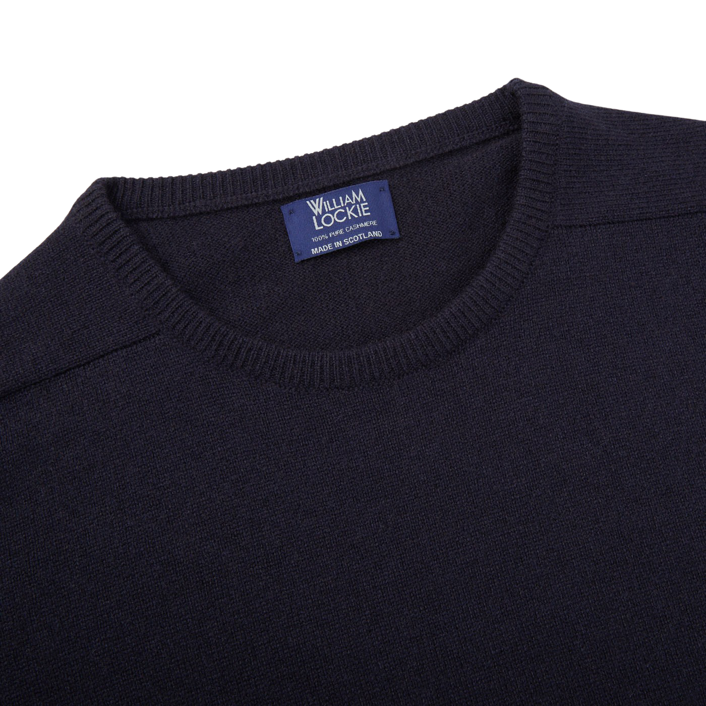 A William Lockie navy crewneck cashmere sweater with a label on the front.