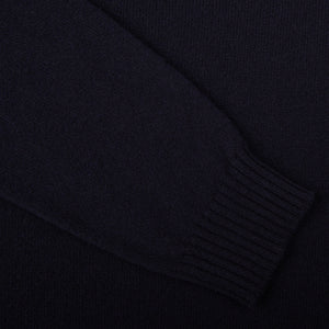 A close up of a William Lockie Navy Crewneck Lambswool Sweater.