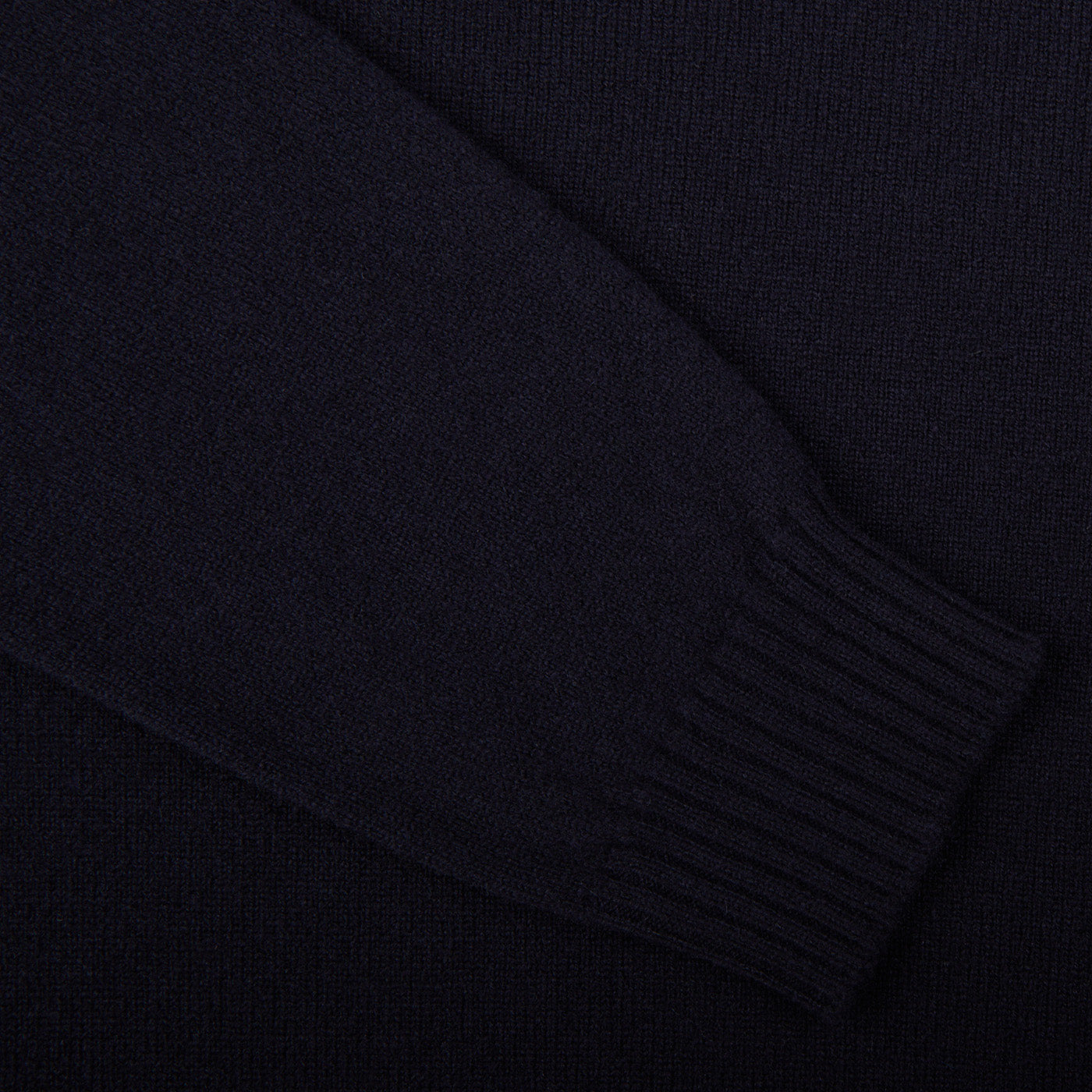 A close up of a William Lockie Navy Crewneck Lambswool Sweater.