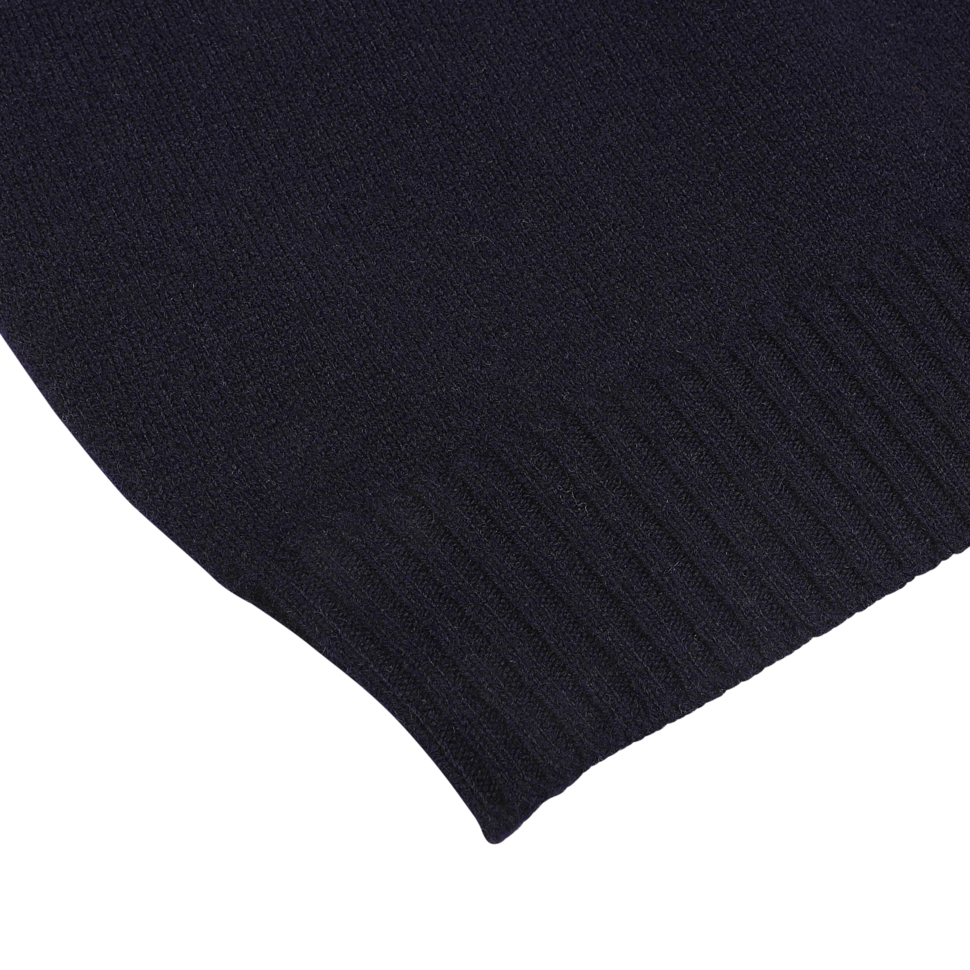 Close-up of the hem of the William Lockie Navy Crewneck Lambswool Sweater, showing ribbed detailing at the edge.