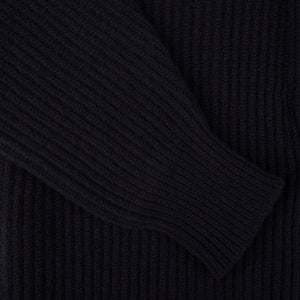 A close up of a Navy Lambswool Shawl Collar Cardigan with leather buttons by William Lockie.
