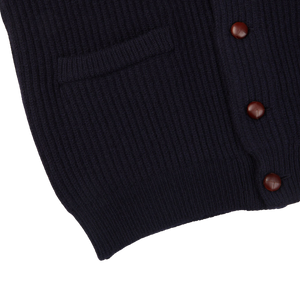 A William Lockie navy lambswool shawl collar cardigan with leather buttons.