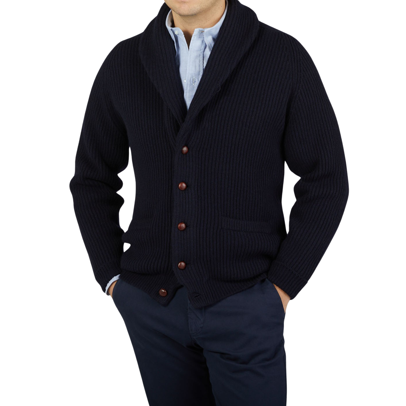 A man wearing a Navy Lambswool Shawl Collar Cardigan made by William Lockie with leather buttons.