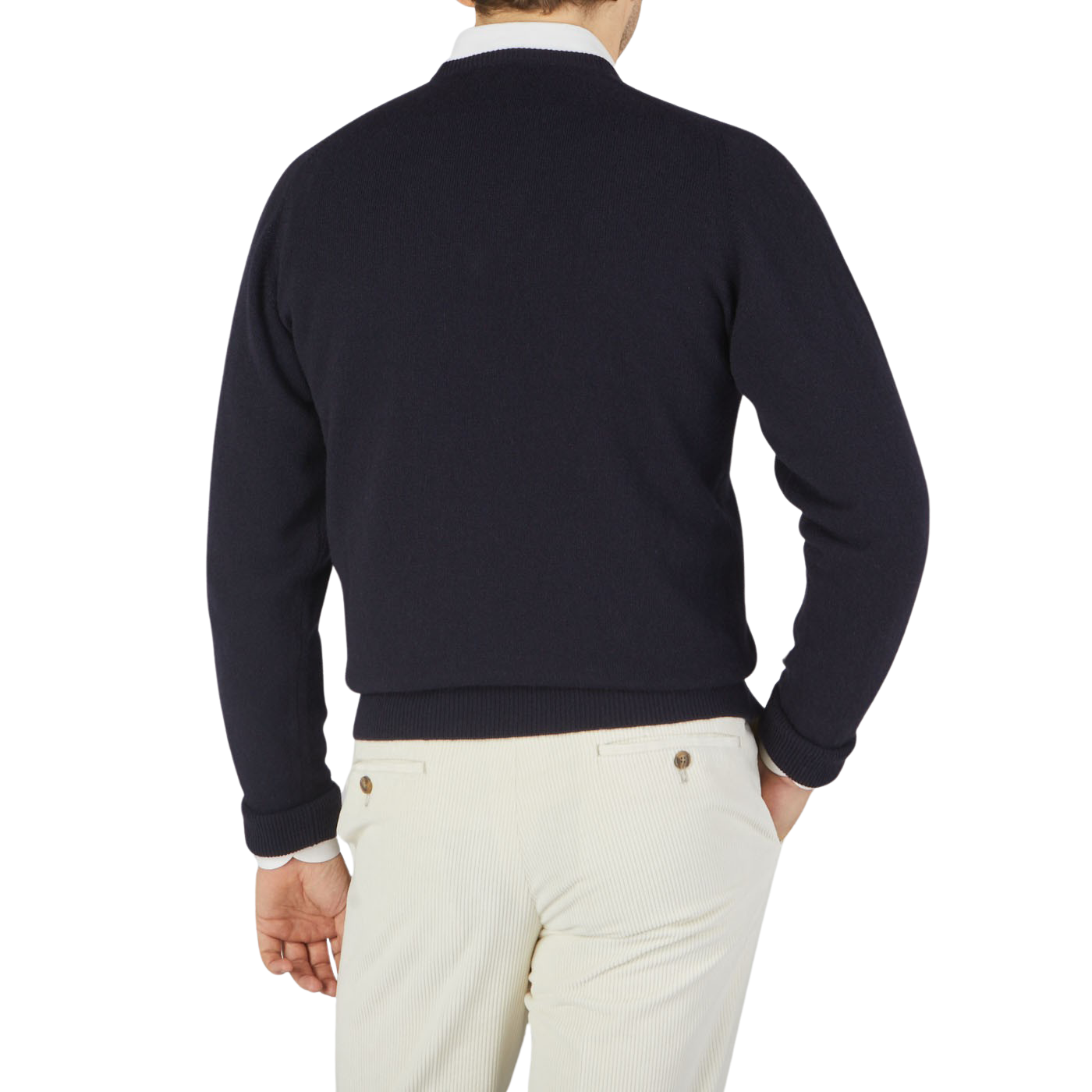 The back view of a man wearing a William Lockie navy Scottish cashmere sweater.