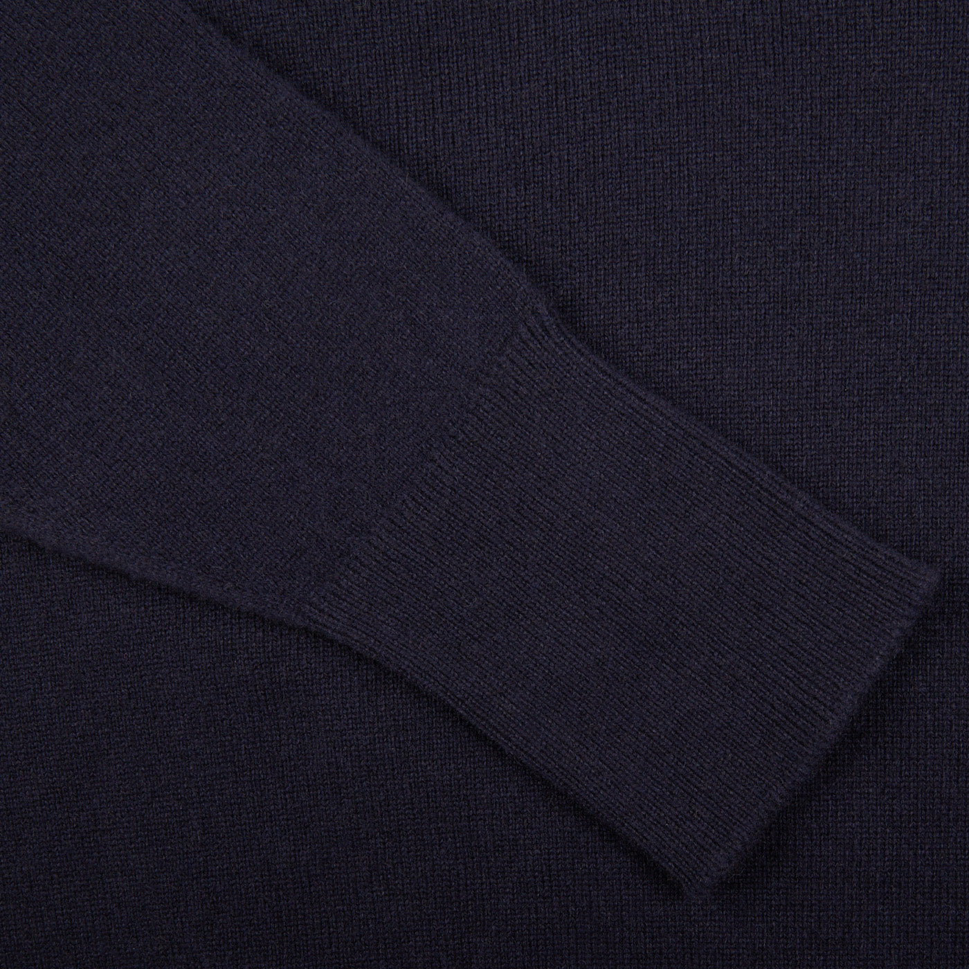 A close up of a Navy V-Neck Cashmere Sweater made with Scottish cashmere by William Lockie.