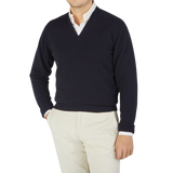 Men's William Lockie navy cashmere v-neck sweater featuring ribbed hems.