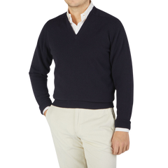 Men's William Lockie navy cashmere v-neck sweater featuring ribbed hems.