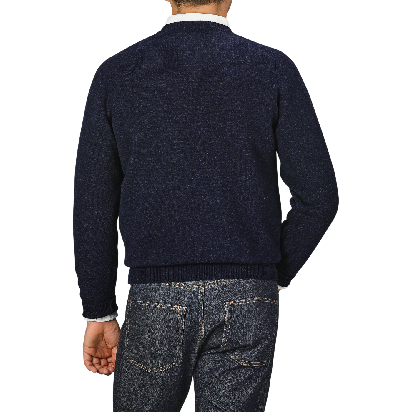 A person wearing a William Lockie Oxford Blue Deep V-Neck Lambswool Sweater and blue jeans is shown from behind against a plain background.