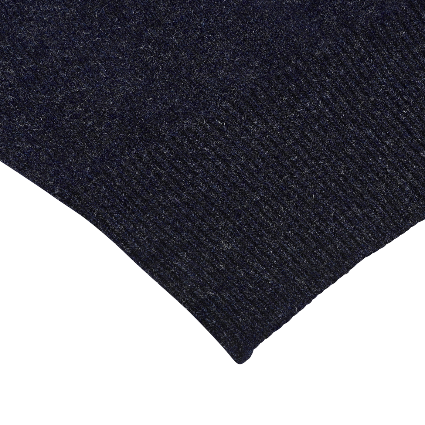 Close-up of the seam and fabric texture of a William Lockie Oxford Blue Deep V-Neck Lambswool Sweater on a light background.