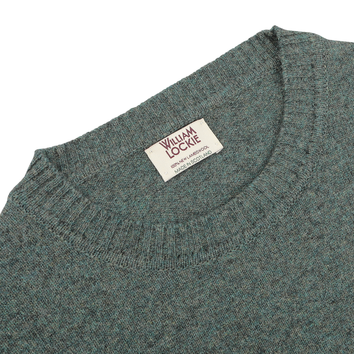 A close-up of a Peacock Crew Neck Lambswool Sweater made from soft Scottish lambswool, featuring a William Lockie brand label.