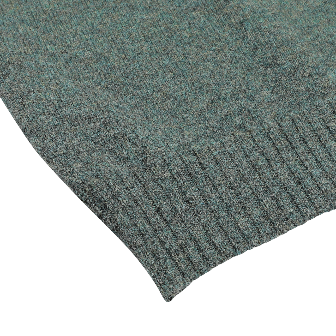 Close-up of the corner of a green, textured knitted fabric featuring a ribbed hem on a plain white background, crafted from luxurious Scottish lambswool. The fabric is from the Peacock Crew Neck Lambswool Sweater by William Lockie.