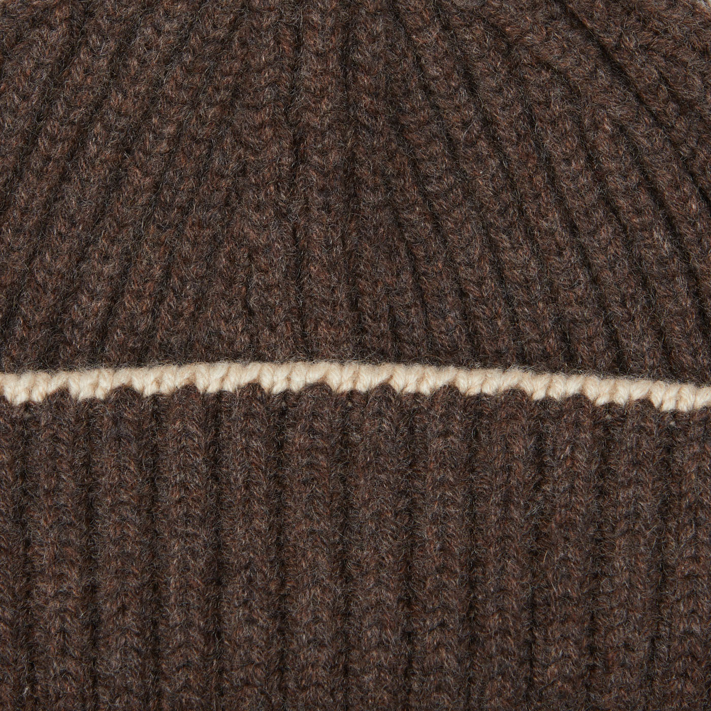 A close up image of a William Lockie Porcupine Alabaster Cashmere Ribbed Short Beanie.