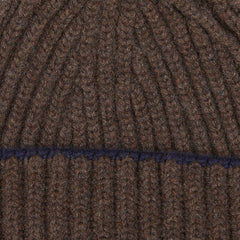 A Porcupine Blackberry Cashmere Ribbed Short Beanie with a blue stripe by William Lockie.