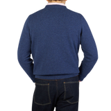 The back view of a man wearing a William Lockie Rhapsody Blue Crew Neck Lambswool Sweater.
