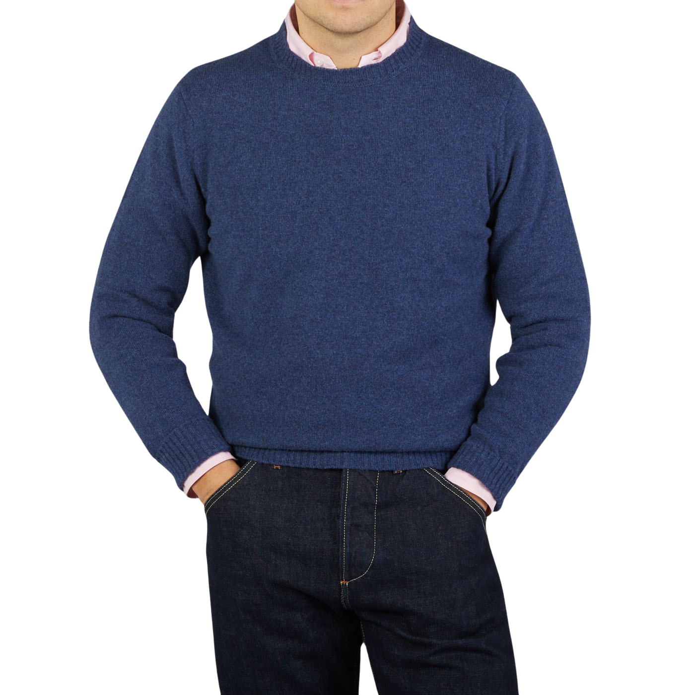 A man wearing a smart casual outfit consisting of a Rhapsody Blue Crew Neck Lambswool Sweater by William Lockie and jeans.