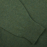 A close up of a Rosemary Green Lambswool Saddle Shoulder Cardigan, made with Scottish lambswool by William Lockie.