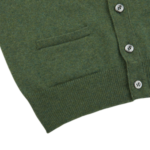 A layering-friendly Rosemary Green Lambswool Saddle Shoulder Cardigan with buttons on the front, made of Scottish lambswool by William Lockie.