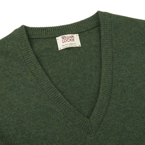 Stay cozy and comfortable this season with our William Lockie men's Rosemary Green V-Neck Lambswool Sweater.