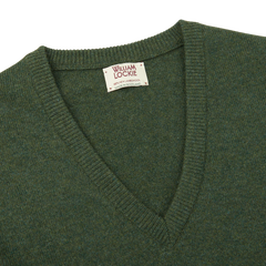 Stay cozy and comfortable this season with our William Lockie men's Rosemary Green V-Neck Lambswool Sweater.