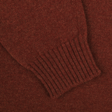 Close-up of a Sienna Brown knitted fabric from a William Lockie lambswool sweater, showcasing a ribbed cuff section.