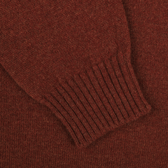 Close-up of a Sienna Brown knitted fabric from a William Lockie lambswool sweater, showcasing a ribbed cuff section.