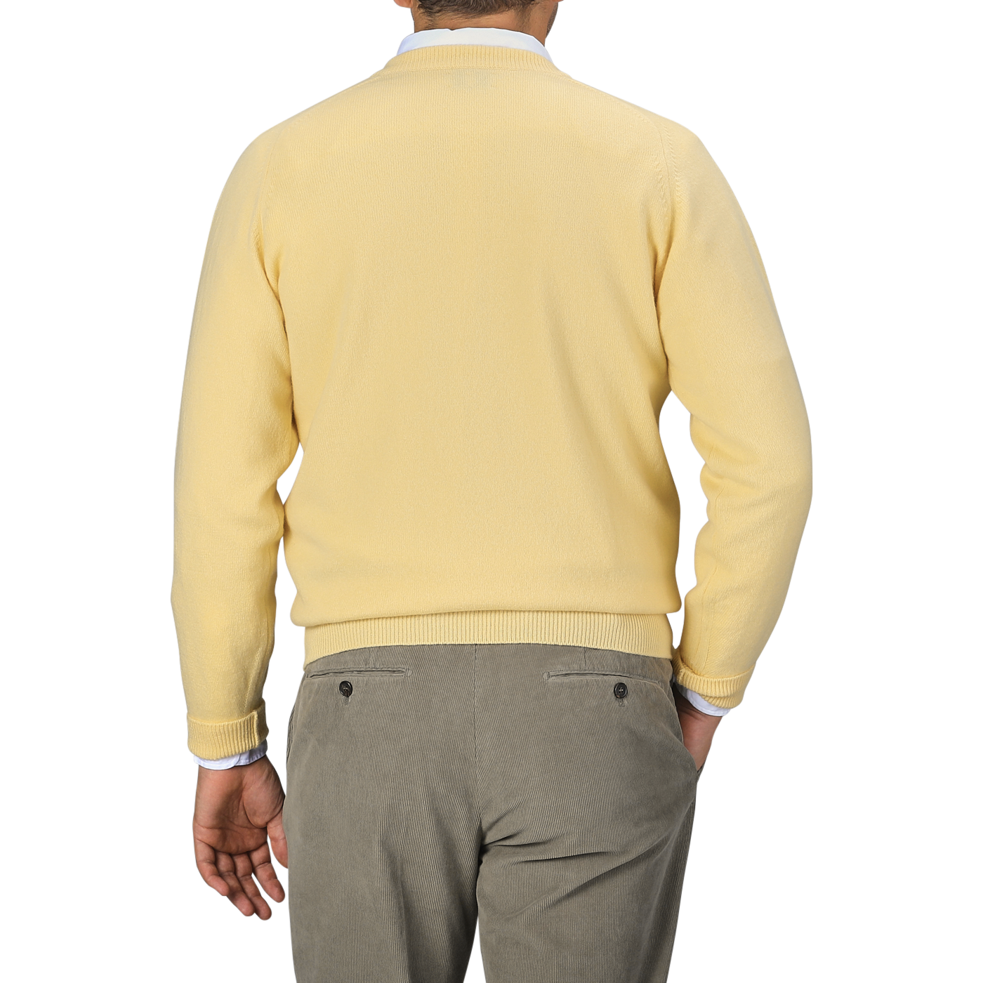 A person is shown from the back wearing a William Lockie Solar Yellow Deep V-Neck Lambswool Sweater and gray pants.