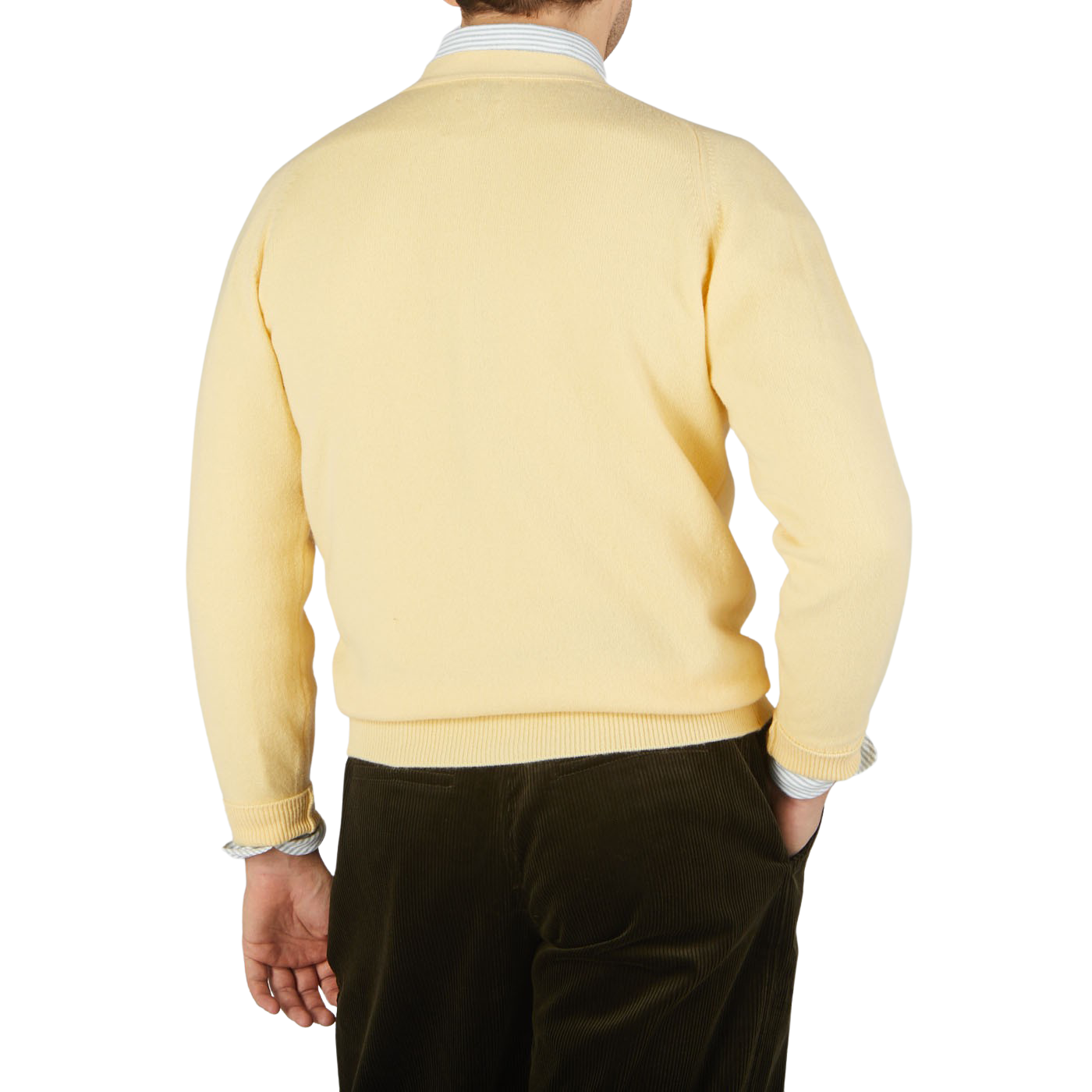 The back view of a man wearing a William Lockie Solar Yellow Lambswool Saddle Shoulder Cardigan.