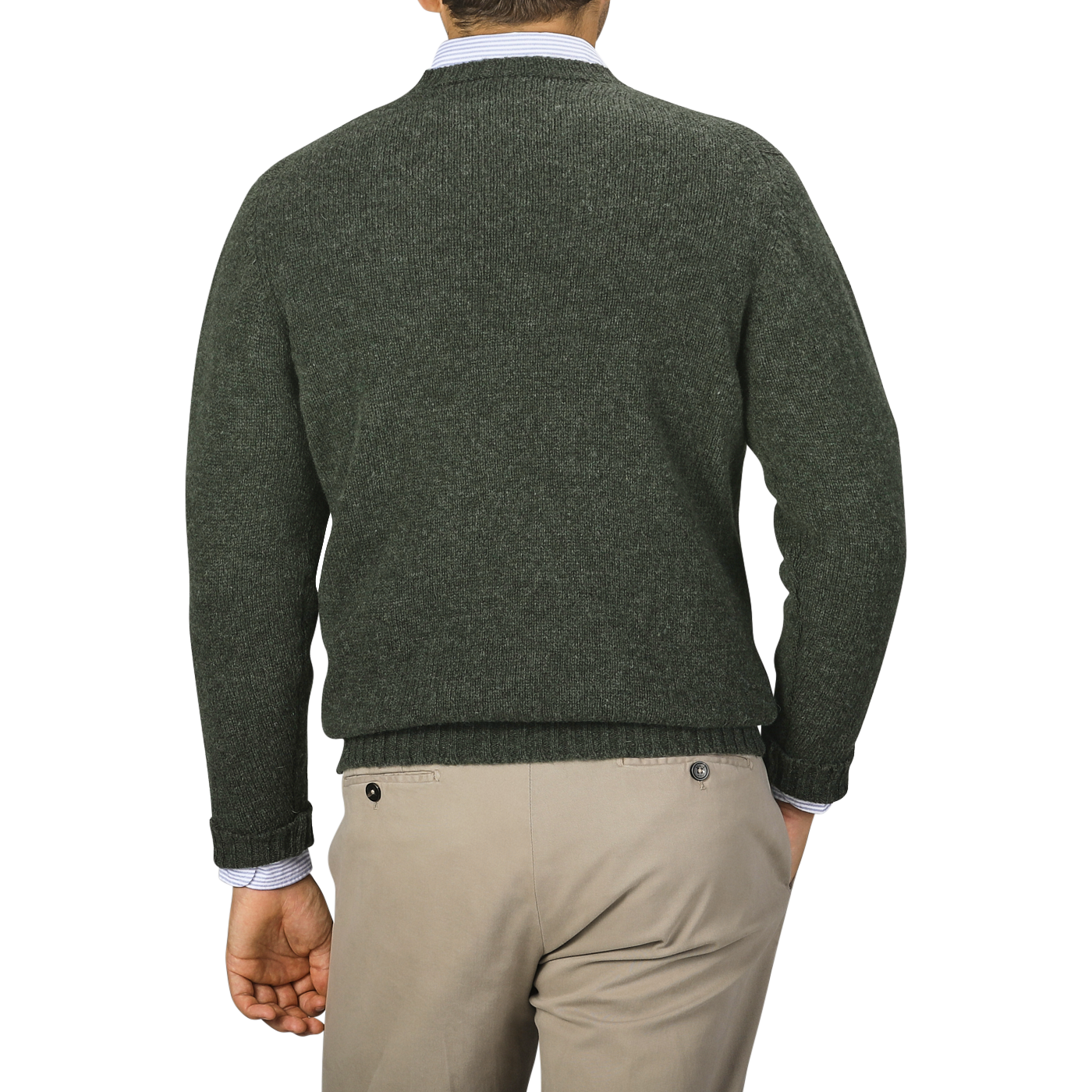 A person wearing a William Lockie Spruce Green Shetland Lambswool V-Neck Sweater over a collared shirt and light beige pants, seen from the back.