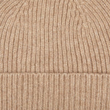 A close up of a Stoneage Beige Cashmere Fine Ribbed Beanie in stoneage beige from William Lockie.