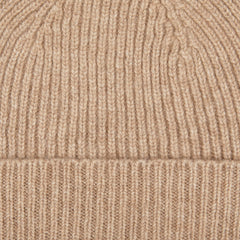 A close up of a Stoneage Beige Cashmere Fine Ribbed Beanie in stoneage beige from William Lockie.