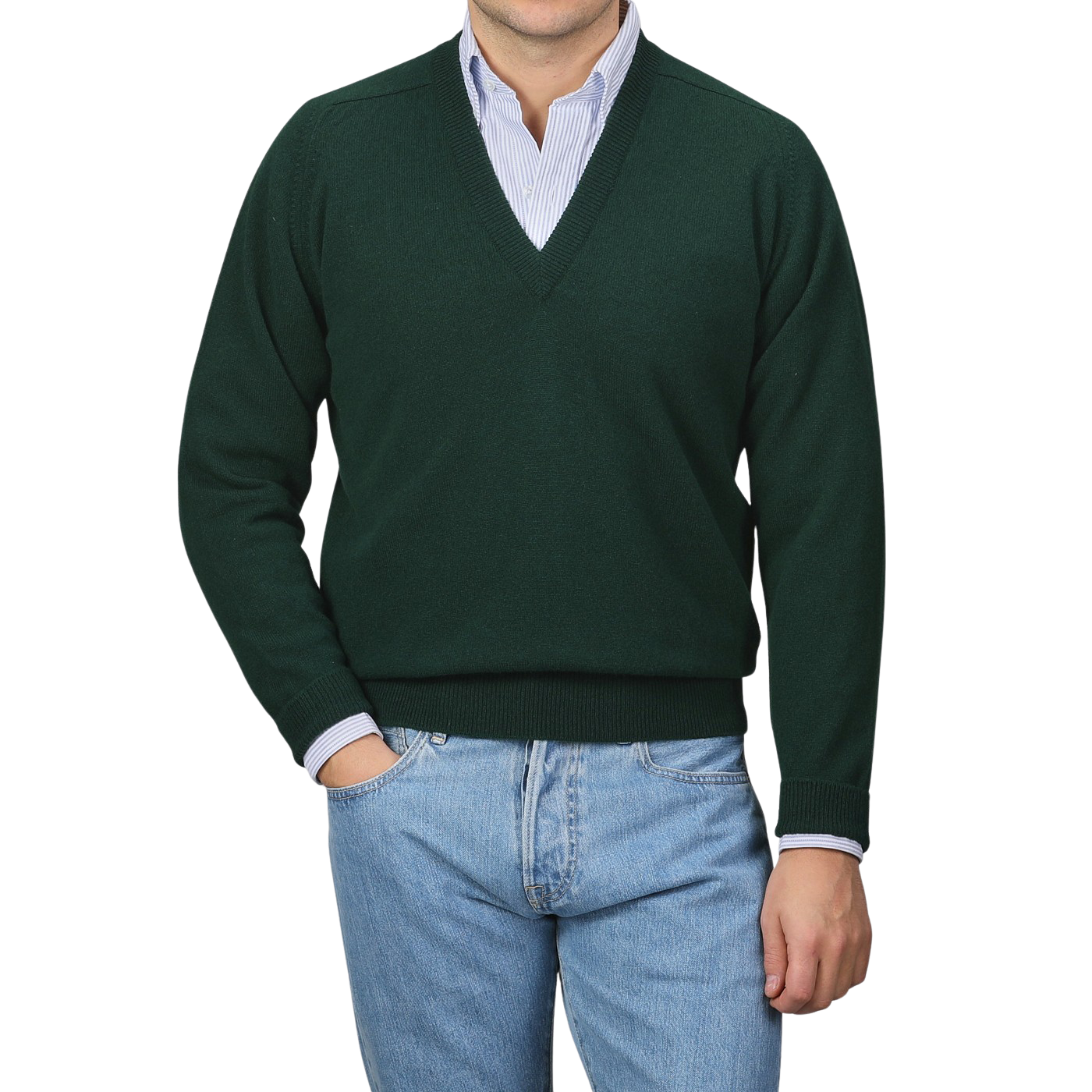 A person in a William Lockie Tartan Green Deep V-Neck Lambswool Sweater and blue jeans stands against a plain background.