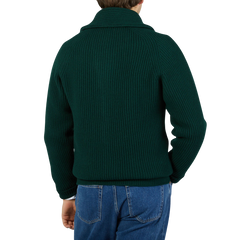 The man is seen from the back wearing a Tartan Green Lambswool Shawl Collar Cardigan by William Lockie.