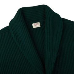 A William Lockie Tartan Green Lambswool Shawl Collar Cardigan with a label on it.