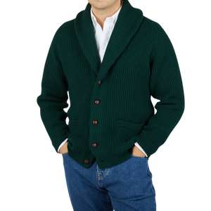 A man wearing a Tartan Green Lambswool Shawl Collar Cardigan by William Lockie.