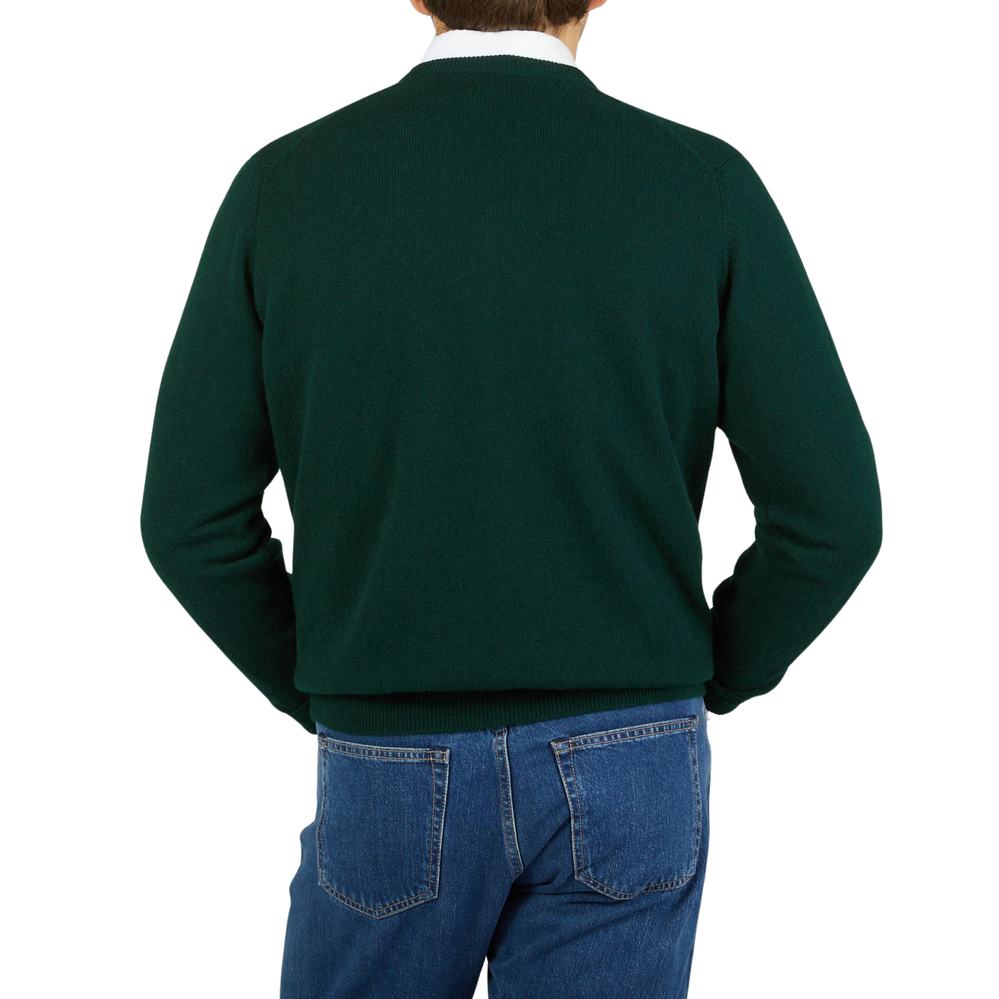 The back view of a man wearing a William Lockie Tartan Green Lambswool V-Neck Sweater and jeans.