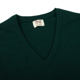 A Tartan Green Lambswool V-Neck Sweater on a white background, made by William Lockie.