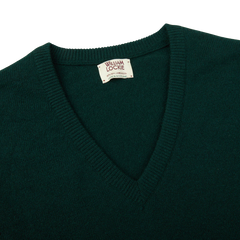 A Tartan Green Lambswool V-Neck Sweater on a white background, made by William Lockie.